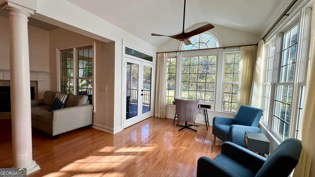 a living room with furniture and a large window