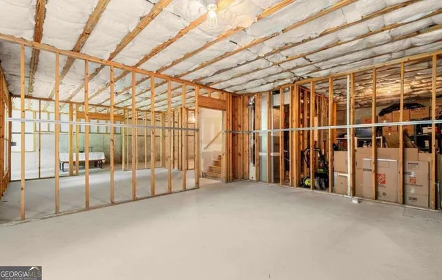 a view of an empty room with wooden walls