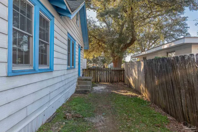 a view of outdoor space with green field and trees