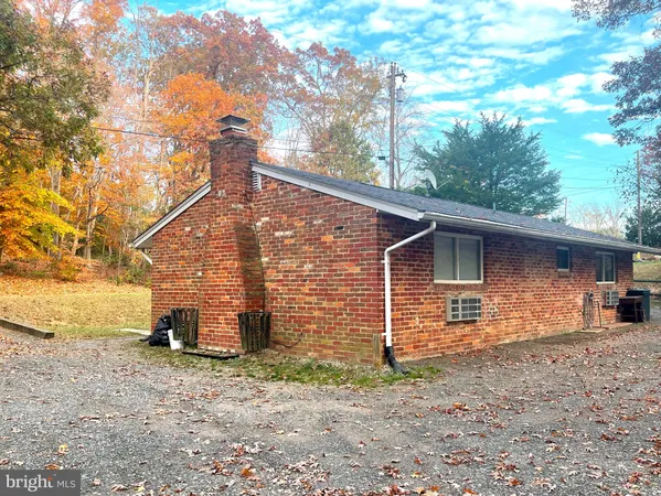 a backyard of a house with barbeque oven