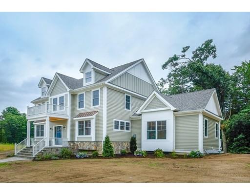 46 Michael Road Wayland, MA 01778 - Photo 2 of 9 a front view of a house with a garden