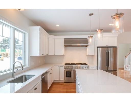 46 Michael Road Wayland, MA 01778 - Photo 3 of 9 a kitchen with kitchen island a counter top a stove a sink and a refrigerator
