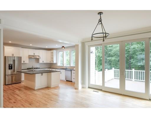 46 Michael Road Wayland, MA 01778 - Photo 8 of 9 a view of a kitchen with stainless steel appliances granite countertop a stove and refrigerator