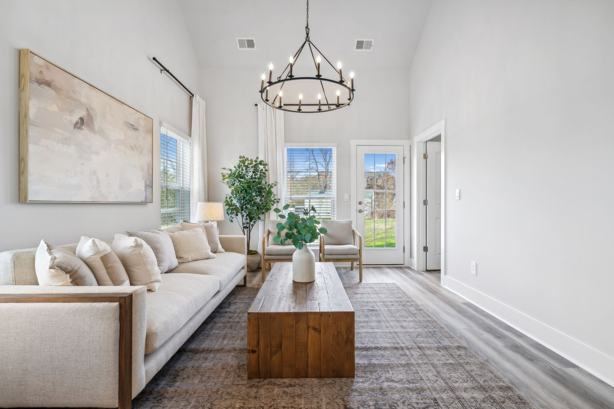 537 Tulip Springs Road Hermitage, TN 37076 - Photo 15 of 58 a living room with furniture a chandelier and a large window