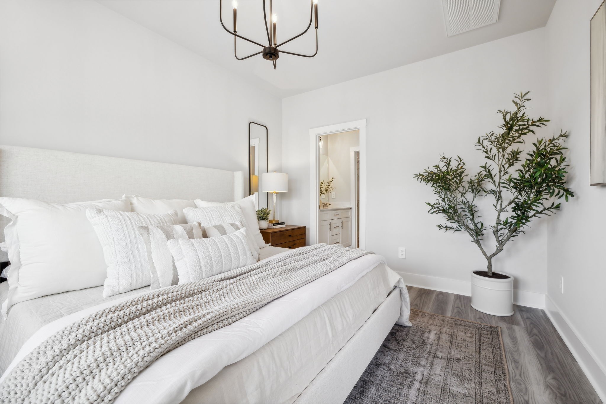 537 Tulip Springs Road Hermitage, TN 37076 - Photo 22 of 58 a bedroom with bed and a potted plant