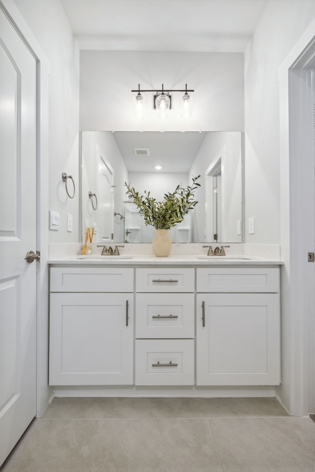 537 Tulip Springs Road Hermitage, TN 37076 - Photo 25 of 58 a bathroom with a sink and a mirror
