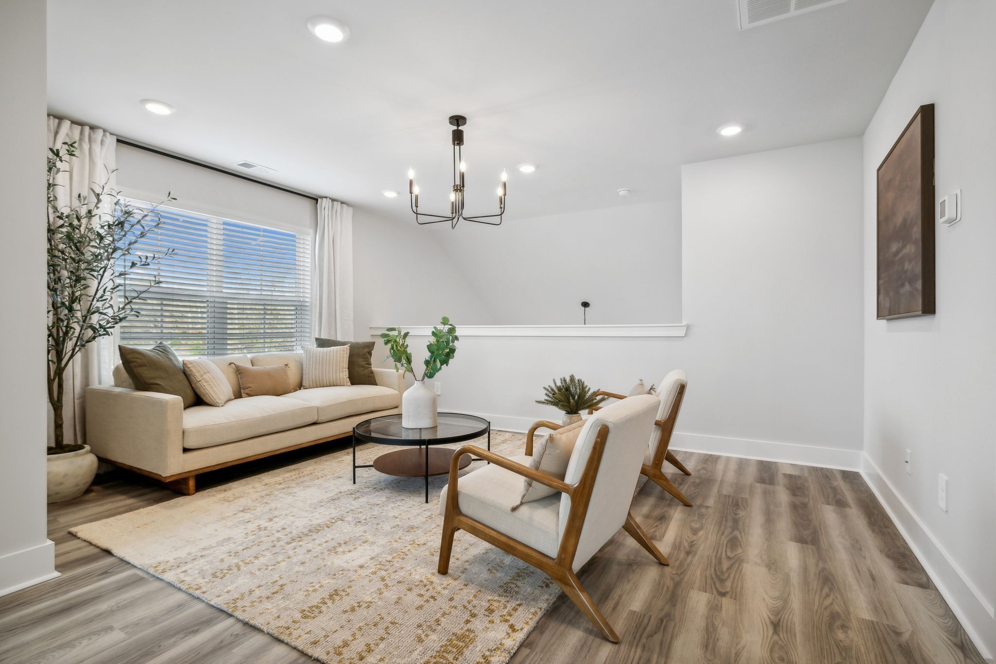 537 Tulip Springs Road Hermitage, TN 37076 - Photo 30 of 58 a living room with furniture and a chandelier