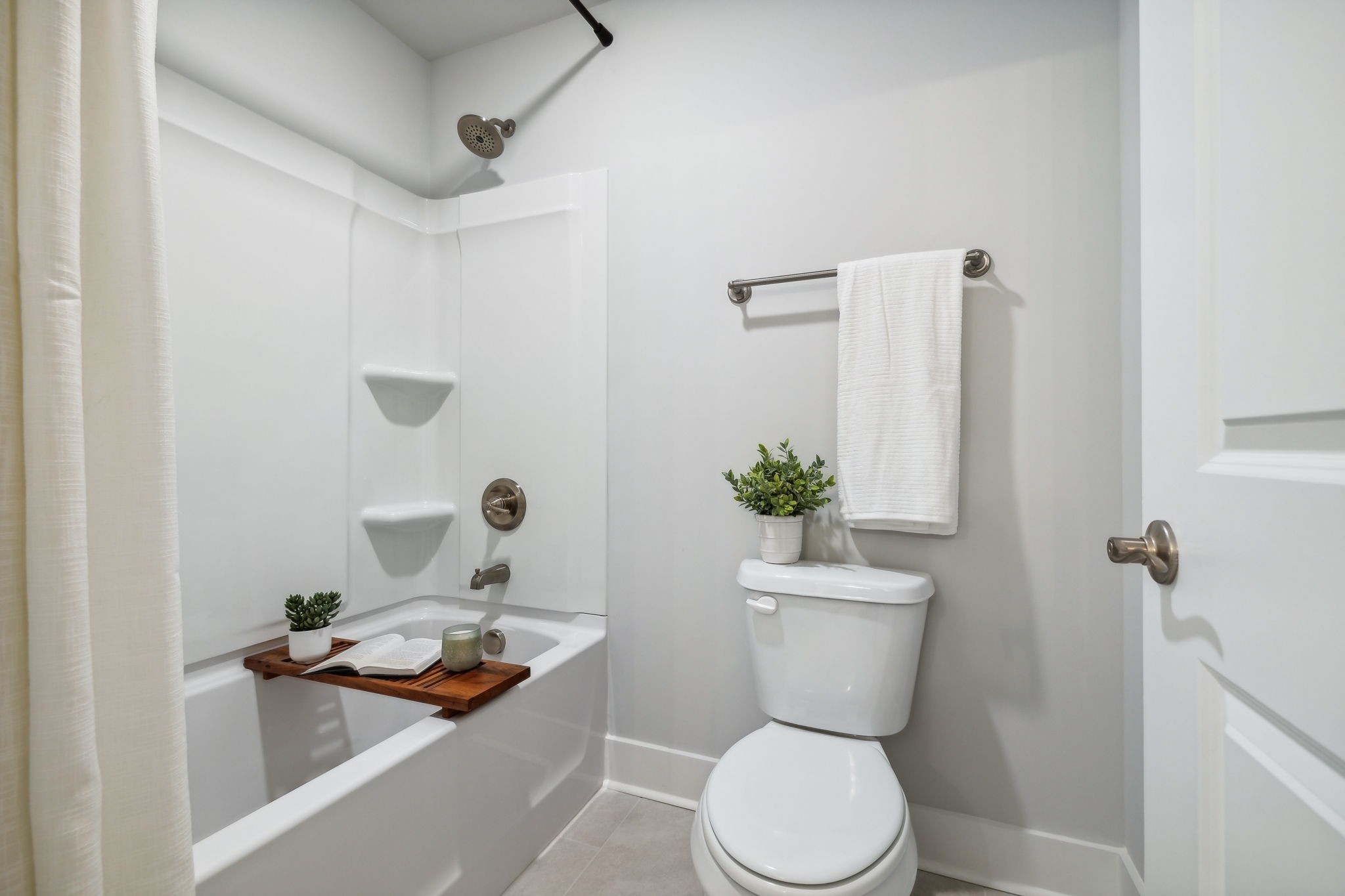 537 Tulip Springs Road Hermitage, TN 37076 - Photo 37 of 58 a bathroom with a toilet a sink and a mirror