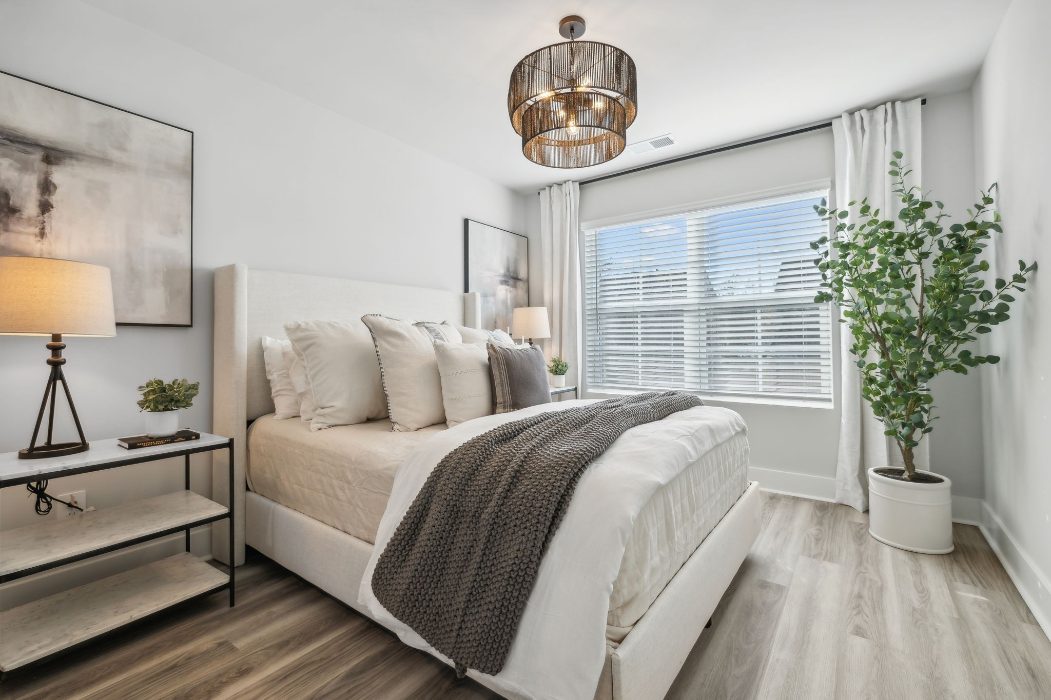 537 Tulip Springs Road Hermitage, TN 37076 - Photo 38 of 58 a spacious bedroom with a bed and a chandelier