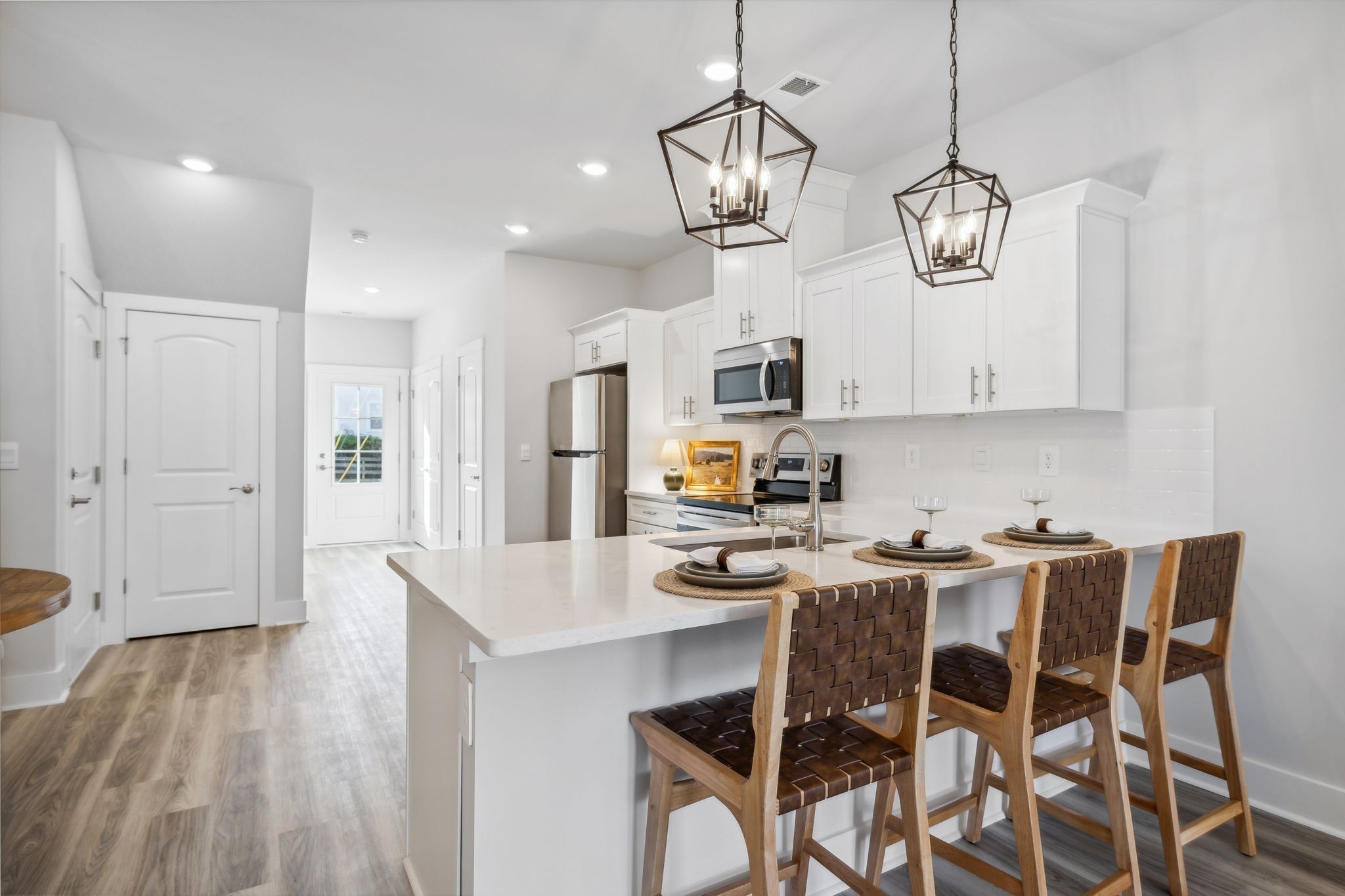 537 Tulip Springs Road Hermitage, TN 37076 - Photo 7 of 58 a view of dining table chairs wooden floor and kitchen