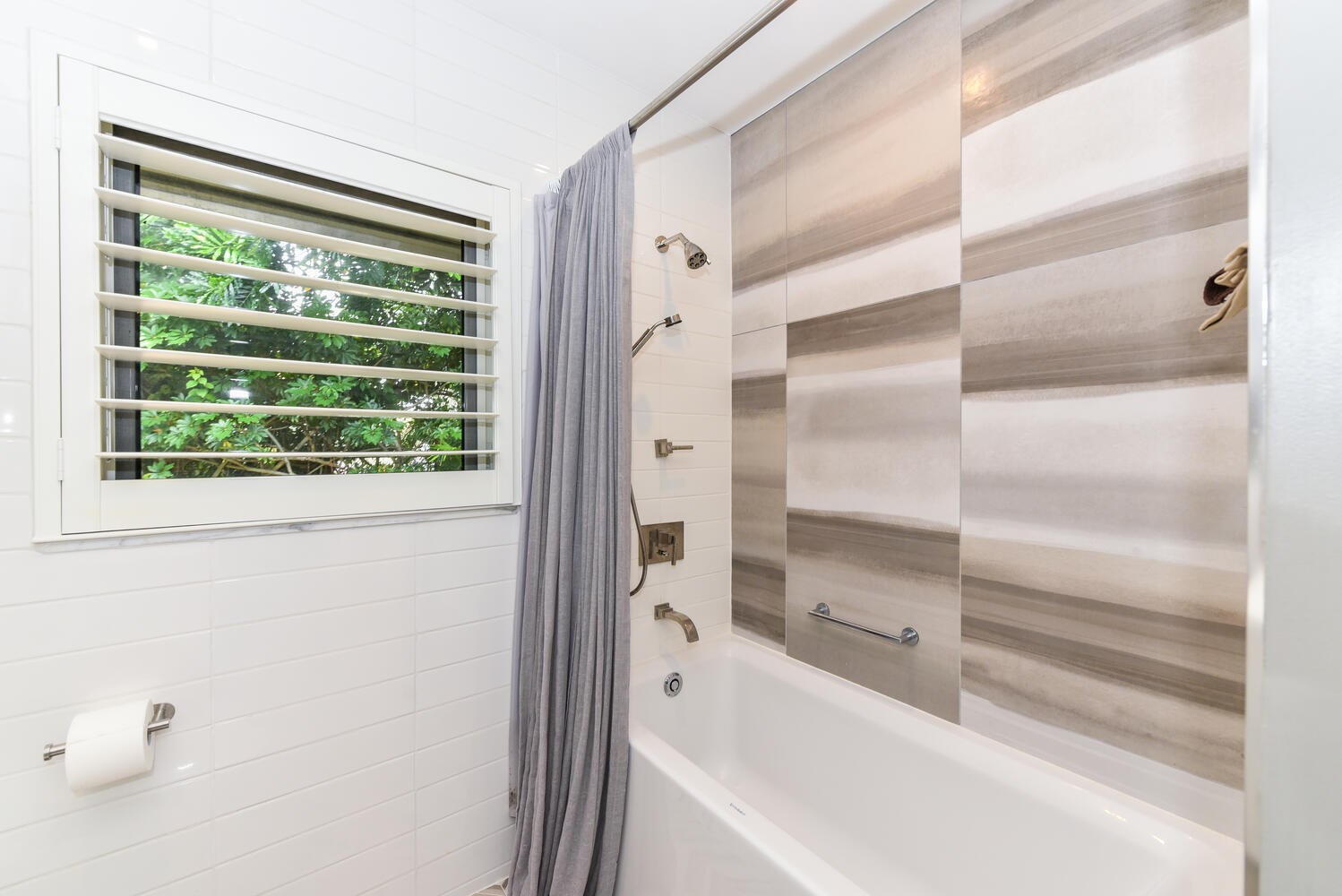 880 Hickory Terrace Boca Raton, FL 33486 - Photo 24 of 38 a bathroom with a bathtub and a shower