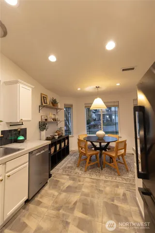 a kitchen with a sink and a stove