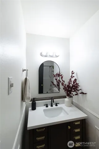 a bathroom with a toilet sink and shower