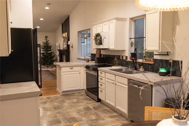 a kitchen with a sink stove and refrigerator