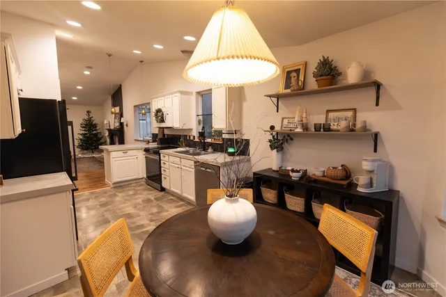 a kitchen with stainless steel appliances granite countertop a stove a sink a refrigerator and a microwave