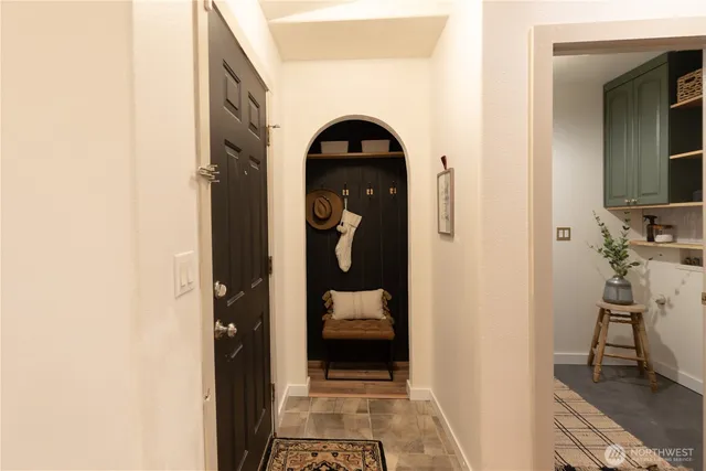 a bedroom with a bed and a mirror