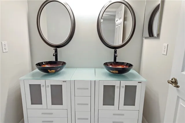 a bathroom with a toilet and a mirror