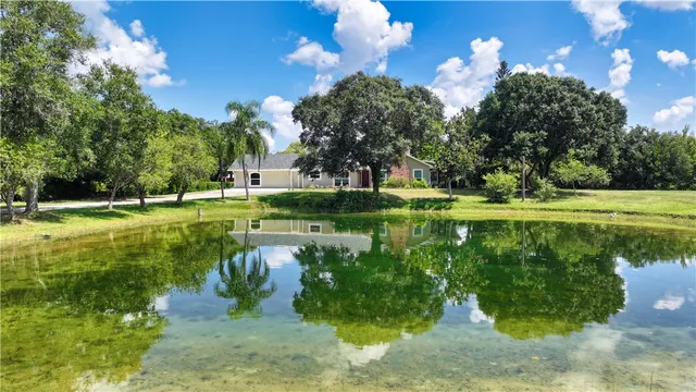 a view of a golf course with a lake view