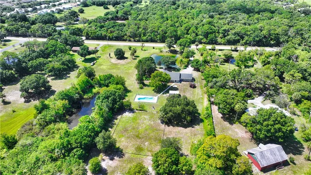an aerial view of house with yard