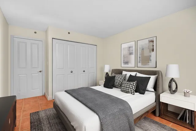 a bedroom with a bed and a desk