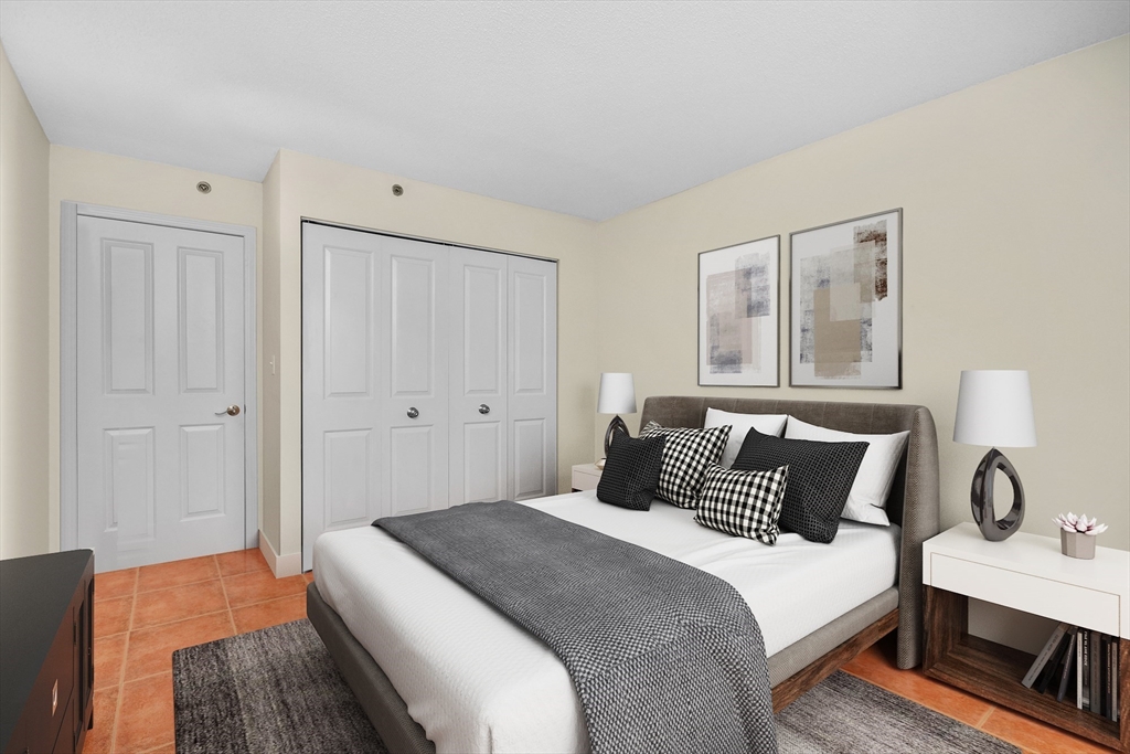 8 Museum Way, Unit 504 Cambridge, MA 02141 - Photo 13 of 30 a bedroom with a bed and a desk