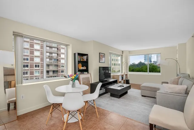 a living room with furniture and a large window