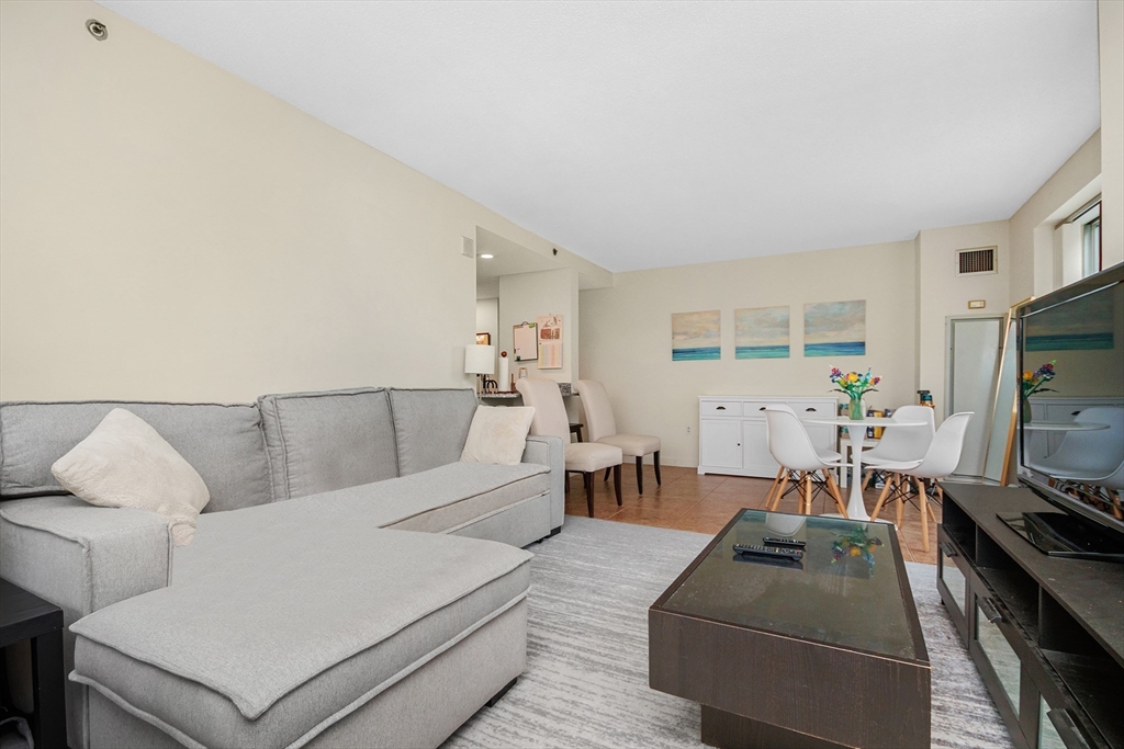 8 Museum Way, Unit 504 Cambridge, MA 02141 - Photo 5 of 30 a living room with furniture and a flat screen tv