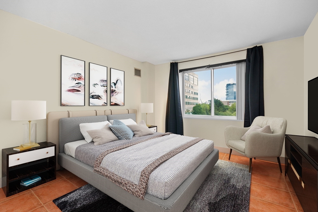 8 Museum Way, Unit 504 Cambridge, MA 02141 - Photo 10 of 30 a bedroom with a bed and a large window