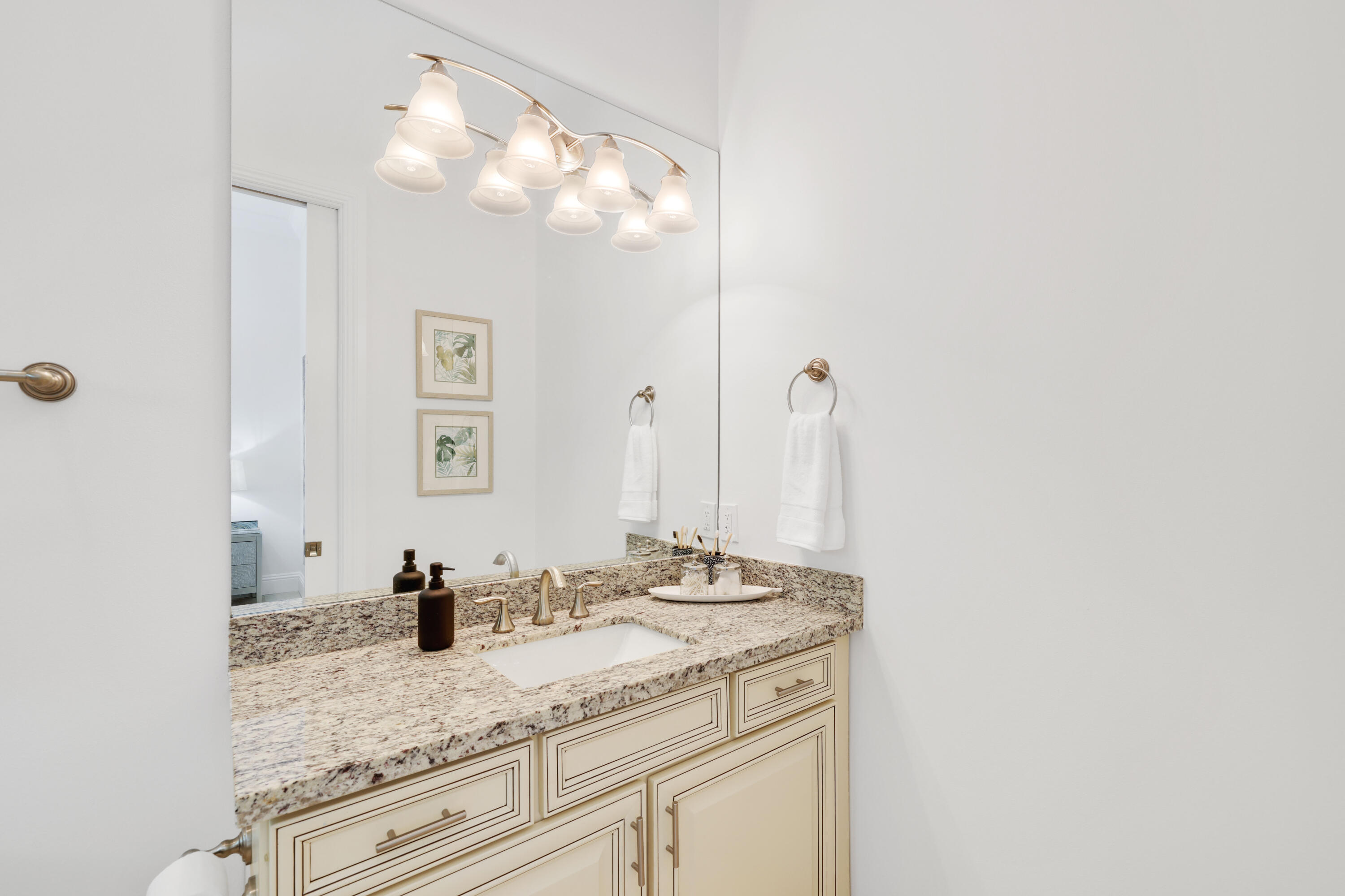 1030 Rhodes Villa Avenue Delray Beach, FL 33483 - Photo 34 of 76 a bathroom with a granite countertop sink and a mirror