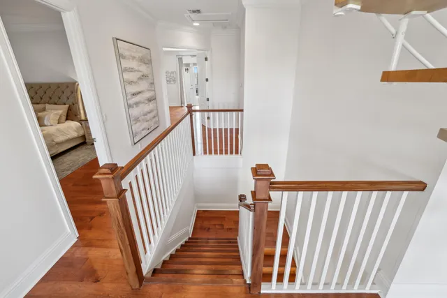 a bedroom with a large bed and a flat screen tv