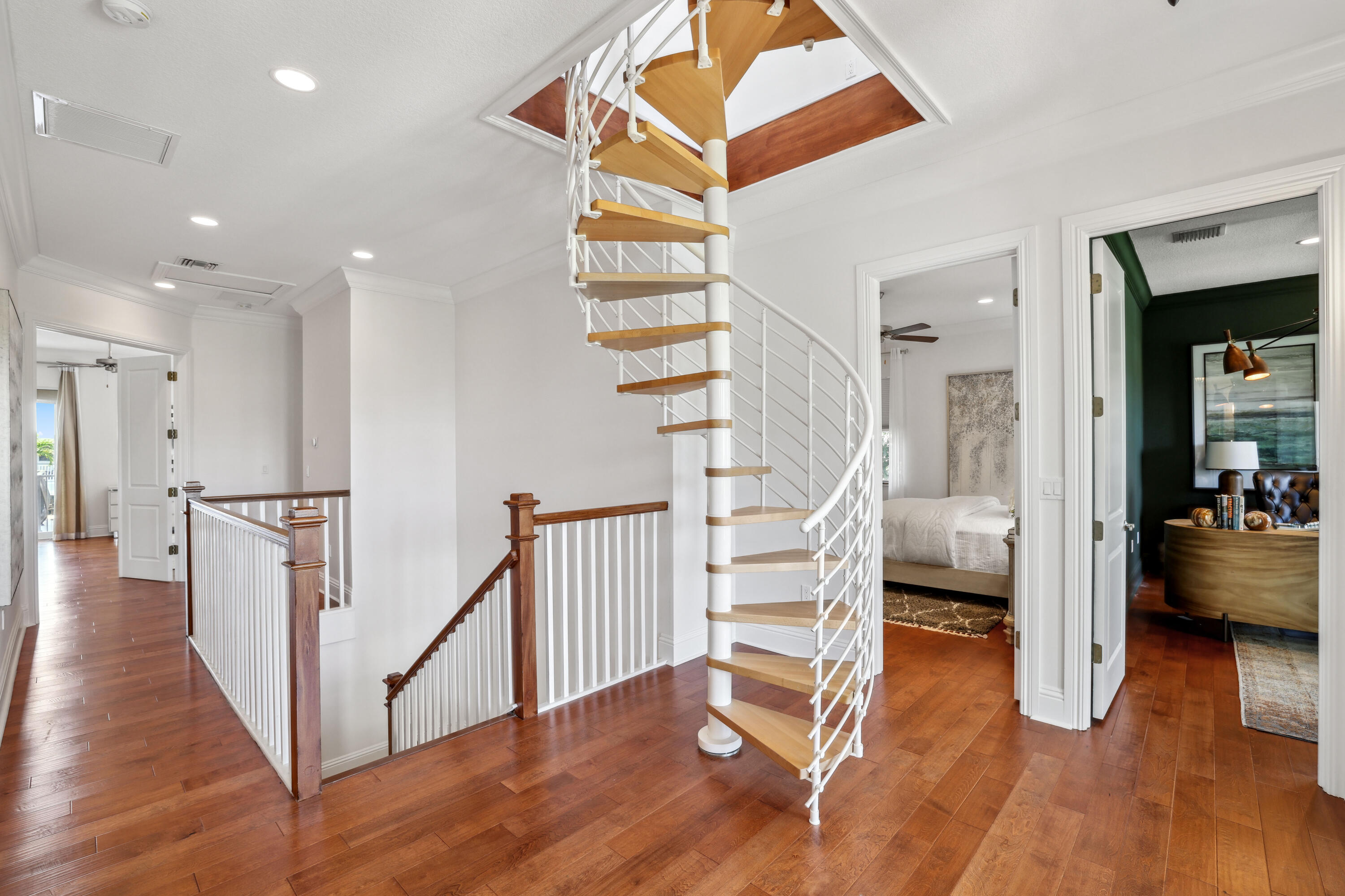 1030 Rhodes Villa Avenue Delray Beach, FL 33483 - Photo 38 of 76 a view of a hallway with wooden floor and staircase