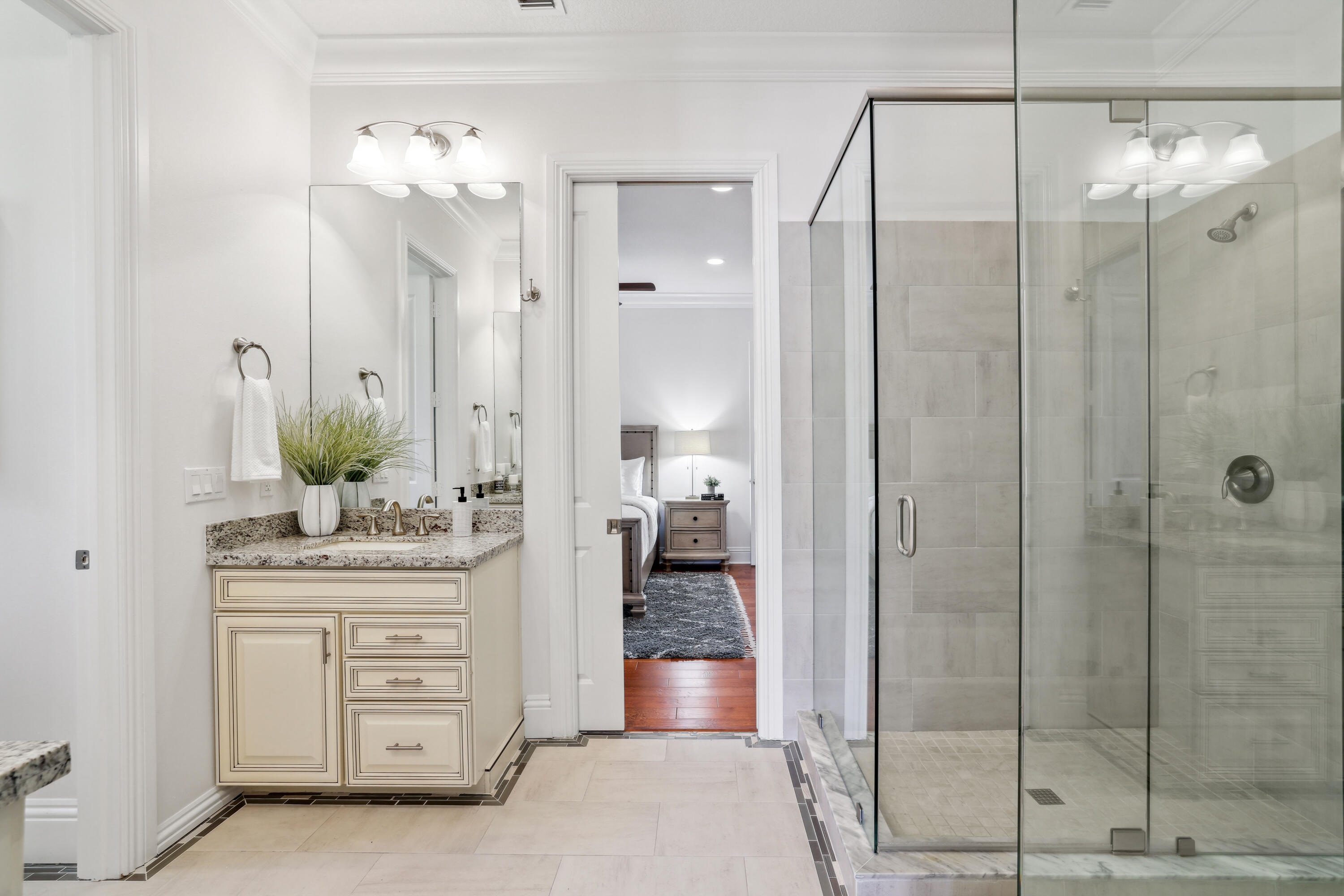 1030 Rhodes Villa Avenue Delray Beach, FL 33483 - Photo 45 of 76 a bathroom with a double vanity sink mirror and shower