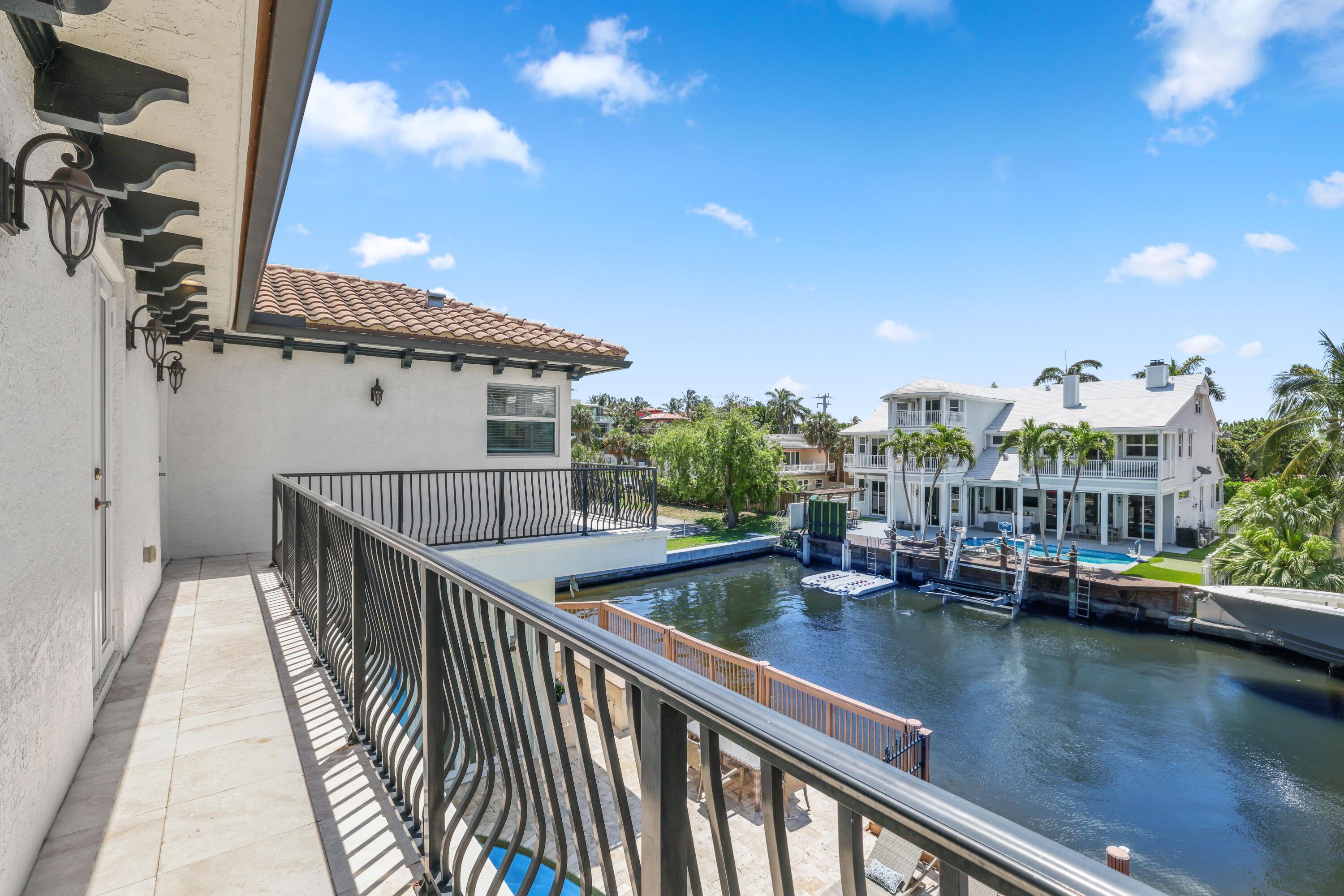 1030 Rhodes Villa Avenue Delray Beach, FL 33483 - Photo 48 of 76 a view of a lake with a terrace