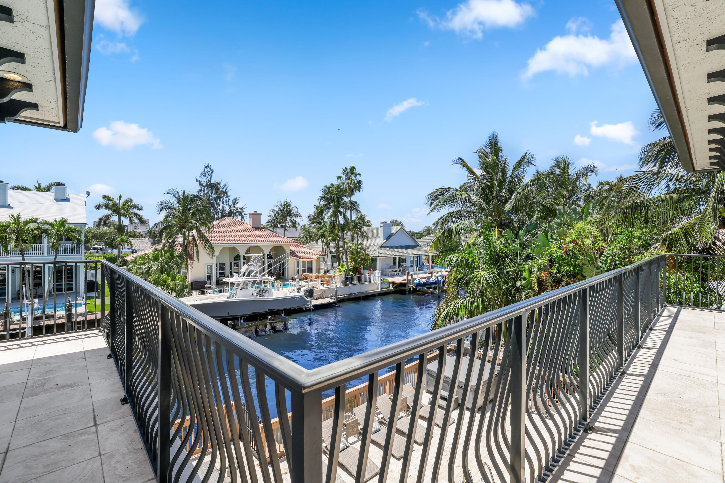 1030 Rhodes Villa Avenue Delray Beach, FL 33483 - Photo 49 of 76 a view of balcony with wooden floor and seating space