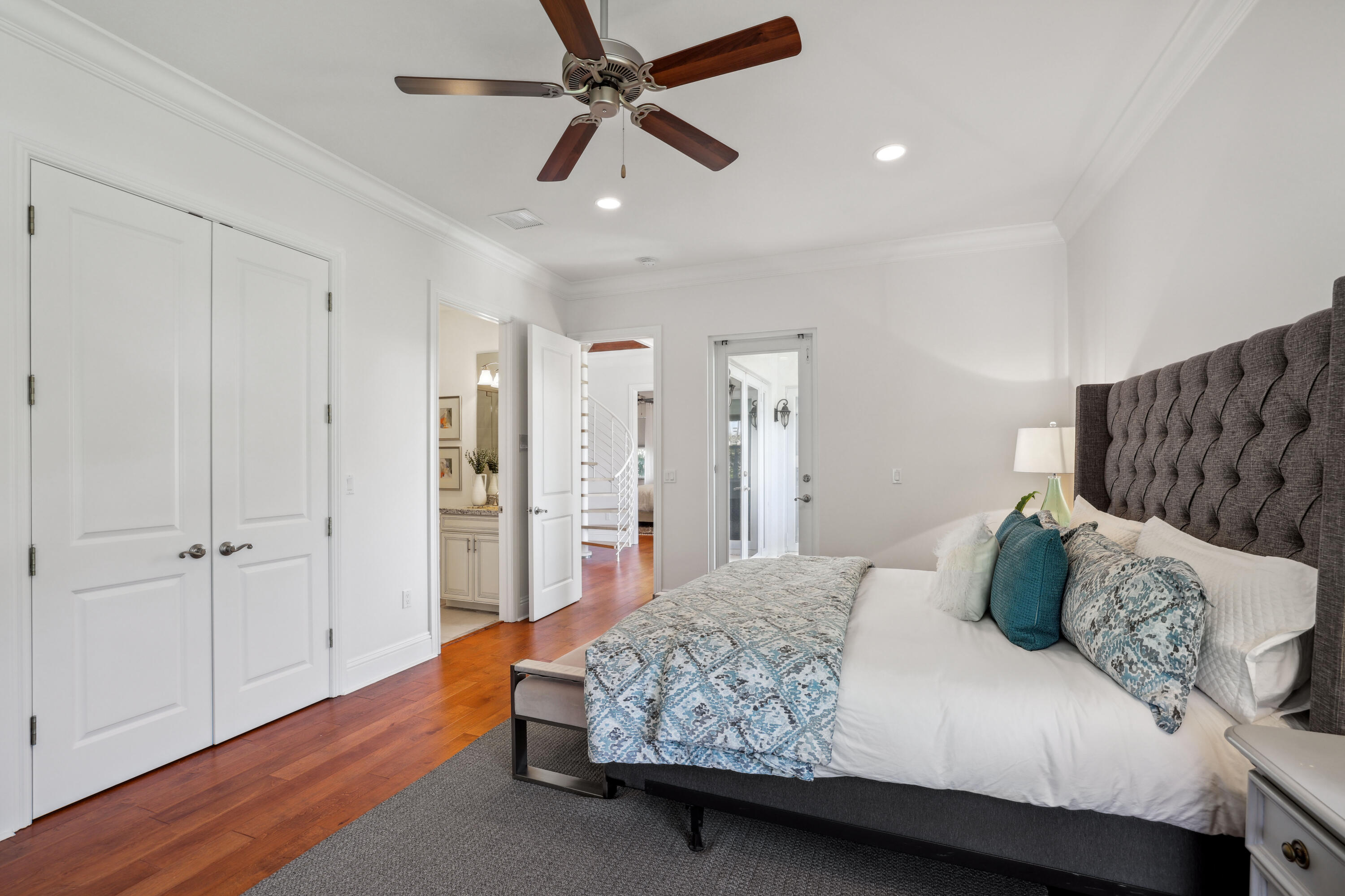 1030 Rhodes Villa Avenue Delray Beach, FL 33483 - Photo 52 of 76 a bedroom with a bed and a chandelier