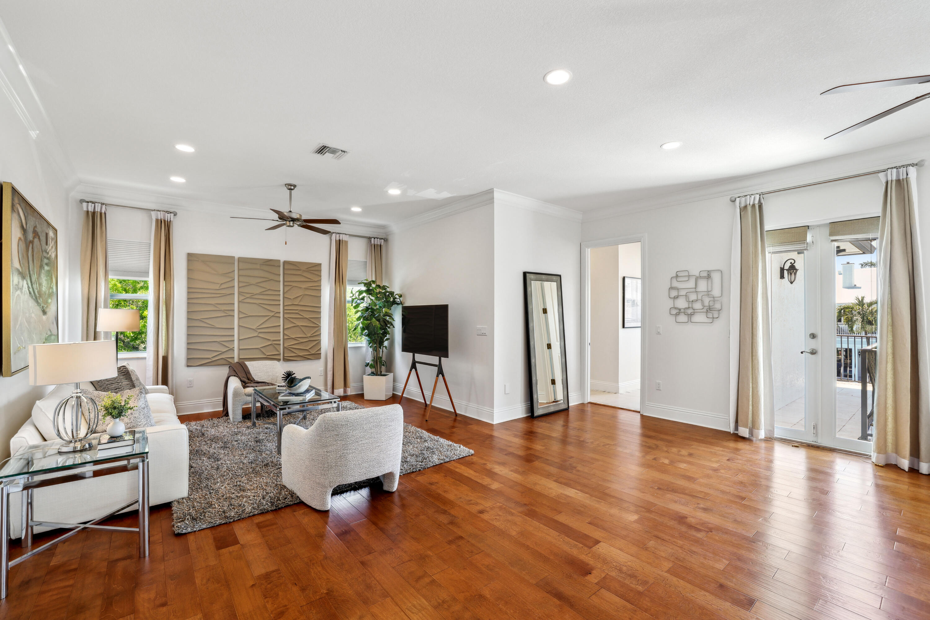 1030 Rhodes Villa Avenue Delray Beach, FL 33483 - Photo 59 of 76 a living room with furniture wooden floor and a large window