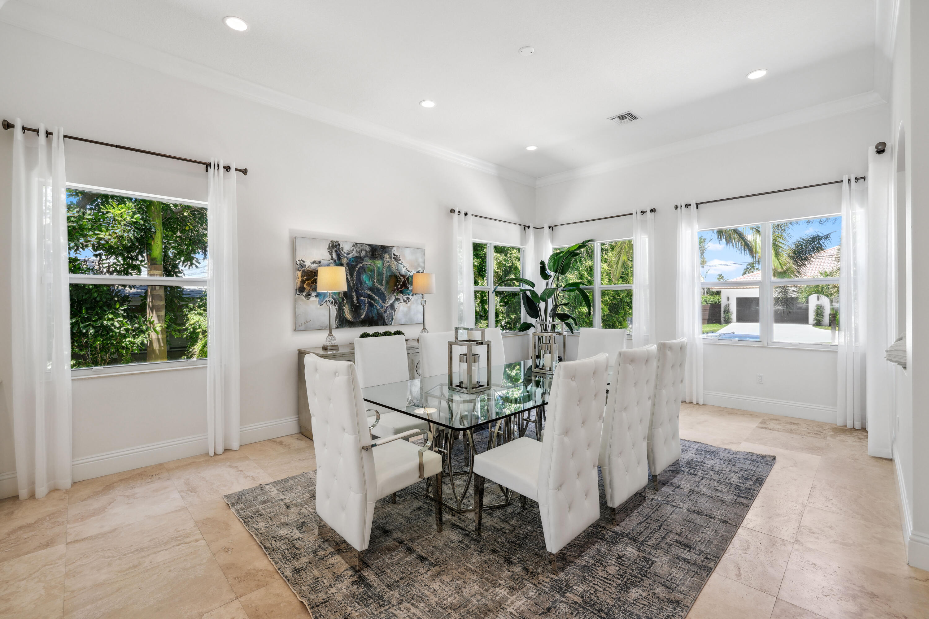 1030 Rhodes Villa Avenue Delray Beach, FL 33483 - Photo 6 of 76 a view of a dining room with furniture window and outside view