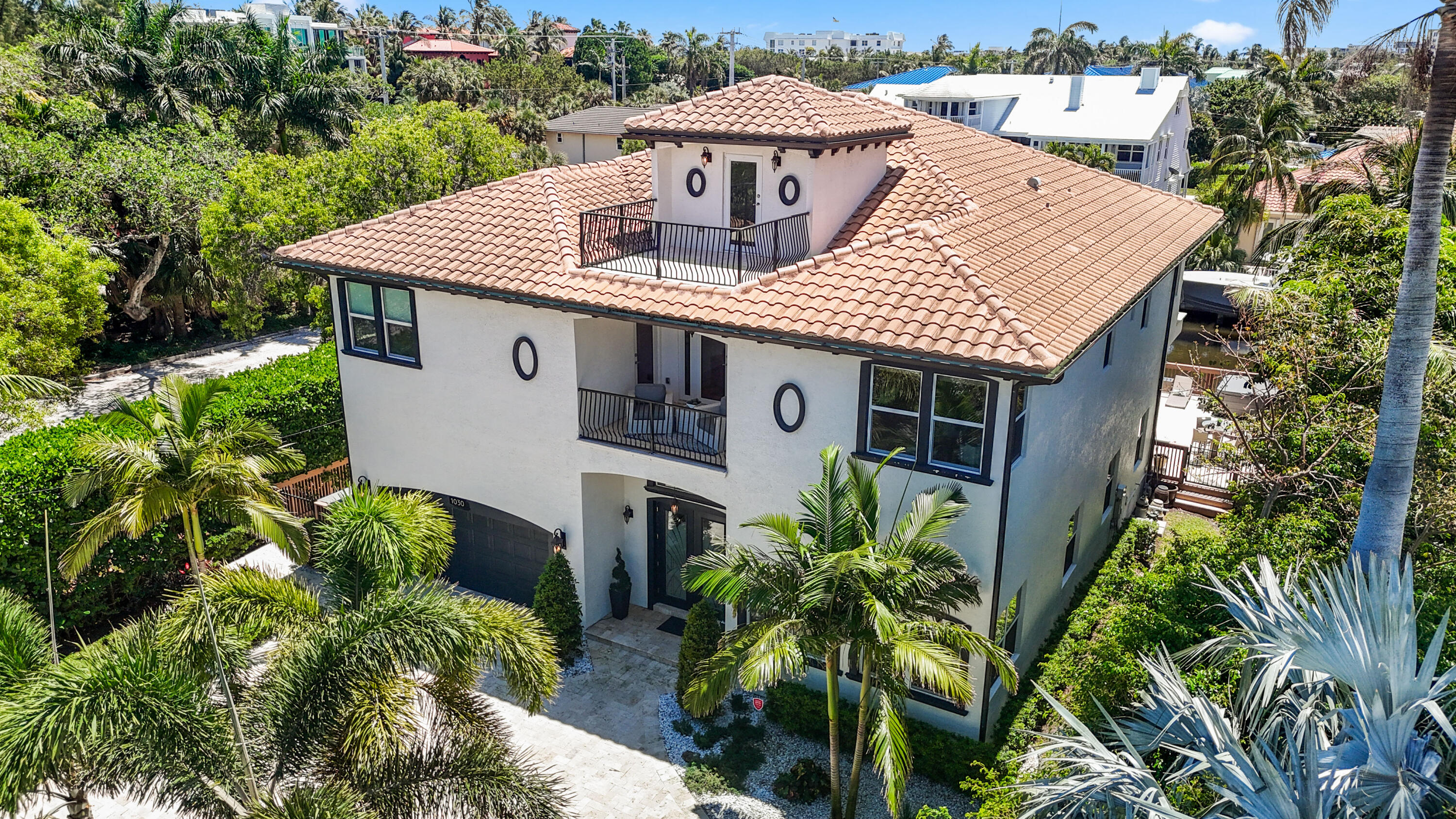 1030 Rhodes Villa Avenue Delray Beach, FL 33483 - Photo 71 of 76 aerial view of a house with a yard and potted plants