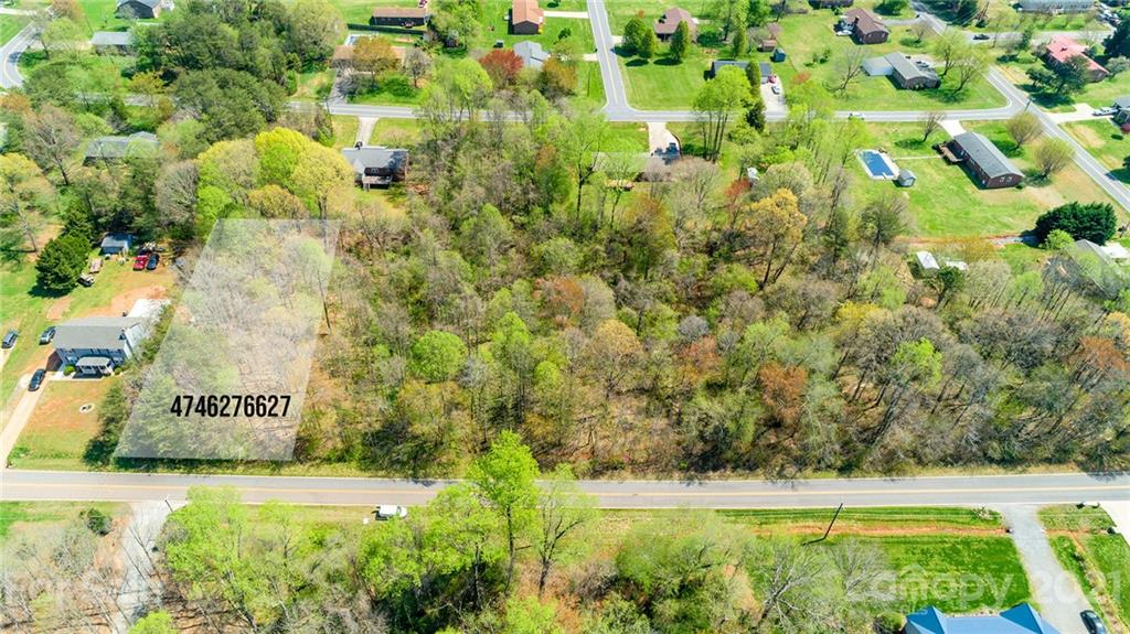 0 Kingswood Road, Unit 7 Statesville, NC 28625 - Photo 1 of 15 a view of a garden with a bench