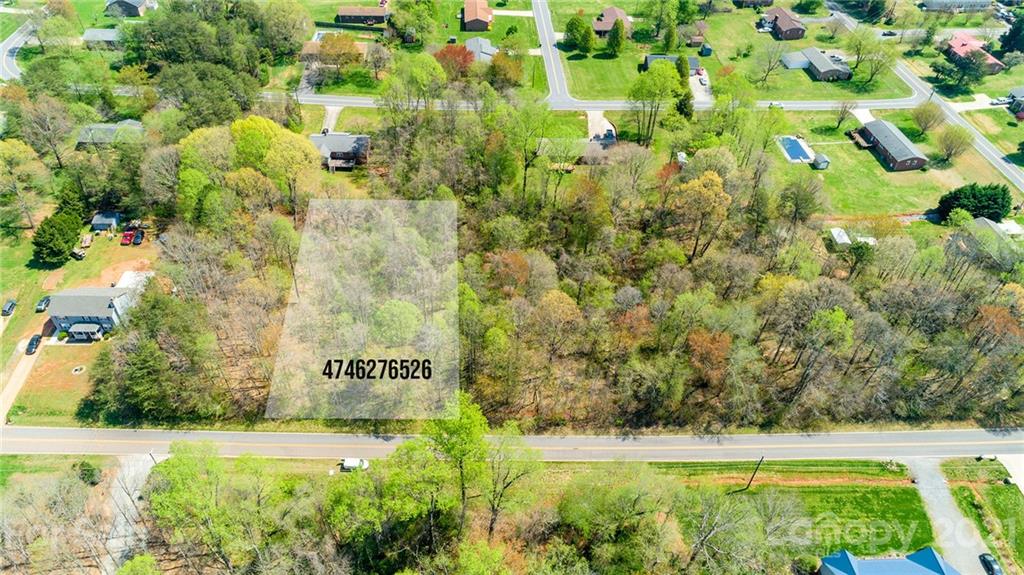 0 Kingswood Road, Unit 7 Statesville, NC 28625 - Photo 2 of 15 a view of a garden with a bench
