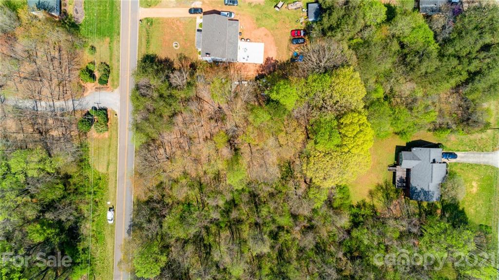 0 Kingswood Road, Unit 7 Statesville, NC 28625 - Photo 15 of 15 a building view with large trees and plants