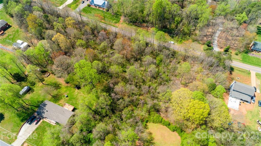 0 Kingswood Road, Unit 7 Statesville, NC 28625 - Photo 8 of 15 a view of a yard with plants and large trees