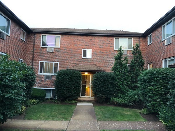 14 Bryon Road, Unit 3 Boston, MA 02467 - Photo 1 of 9 a front view of a house with garden
