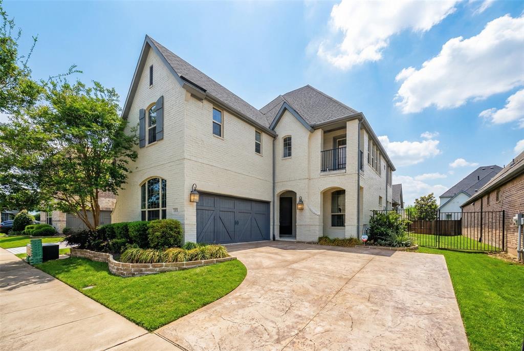 1039 Stephen Street Allen, TX 75013 - Photo 2 of 40 French country inspired facade with brick siding, a balcony, a garage, and driveway