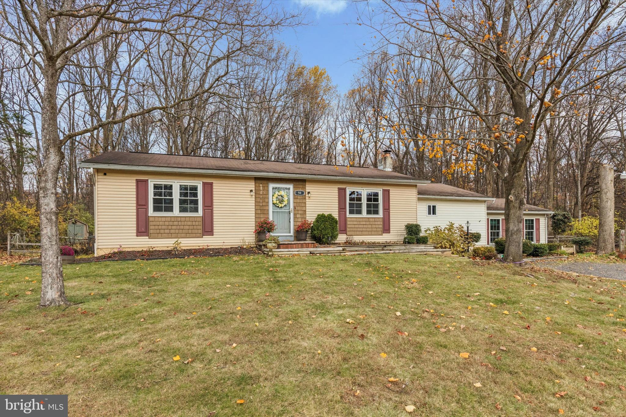 59 Houck Road Schwenksville, PA 19473 - Photo 2 of 39 a view of a house with a patio and yard