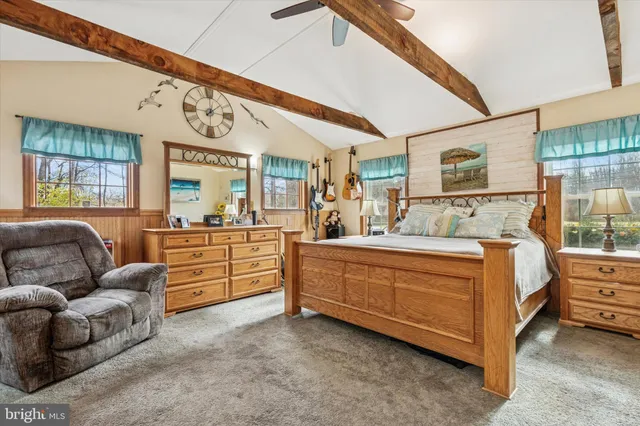 a bed room with furniture and window