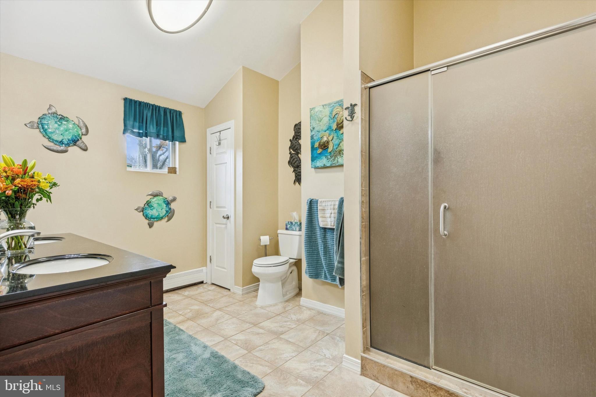 59 Houck Road Schwenksville, PA 19473 - Photo 25 of 39 a bathroom with a granite countertop sink a toilet and shower