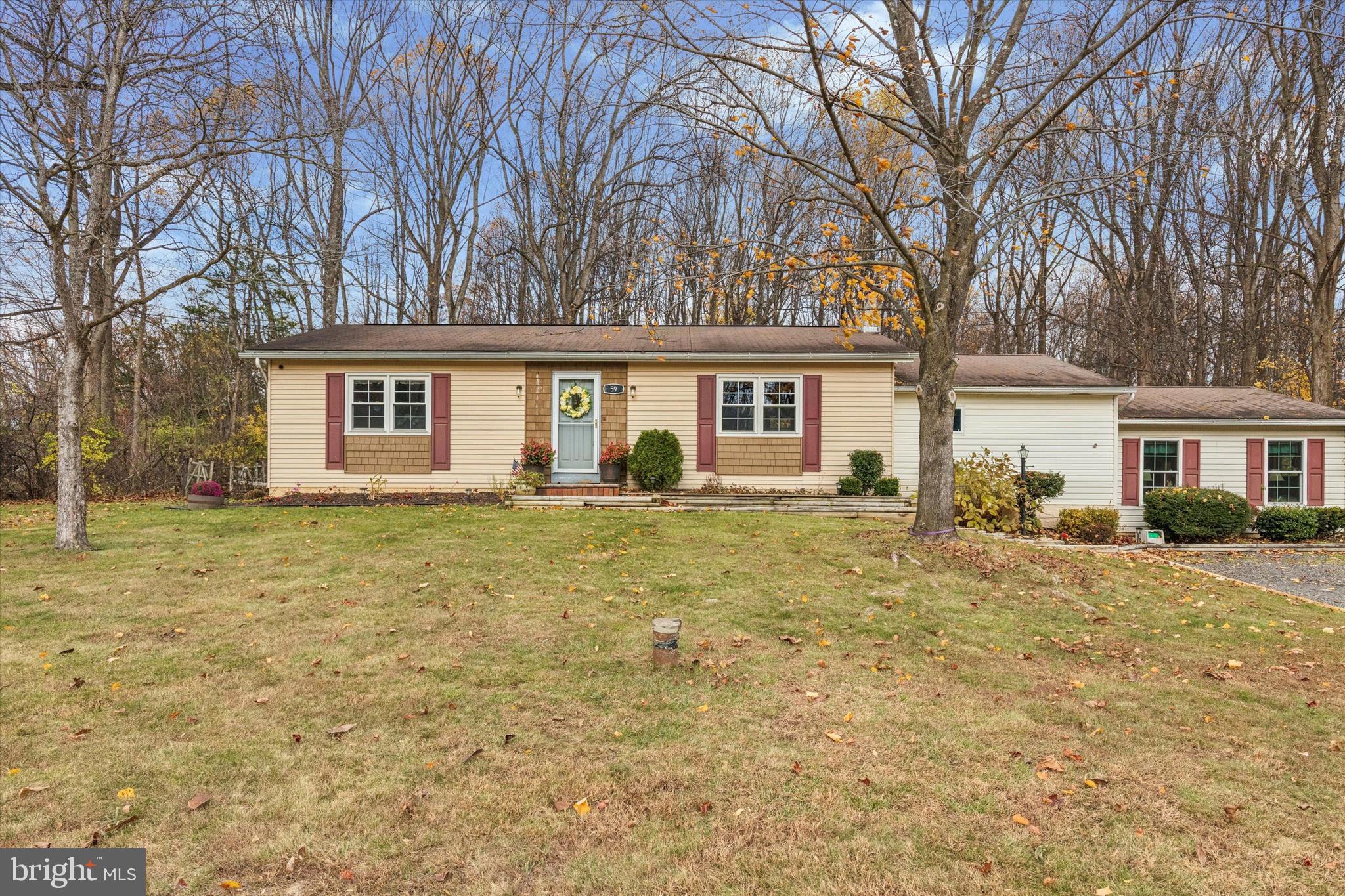 59 Houck Road Schwenksville, PA 19473 - Photo 3 of 39 a front view of a house with garden