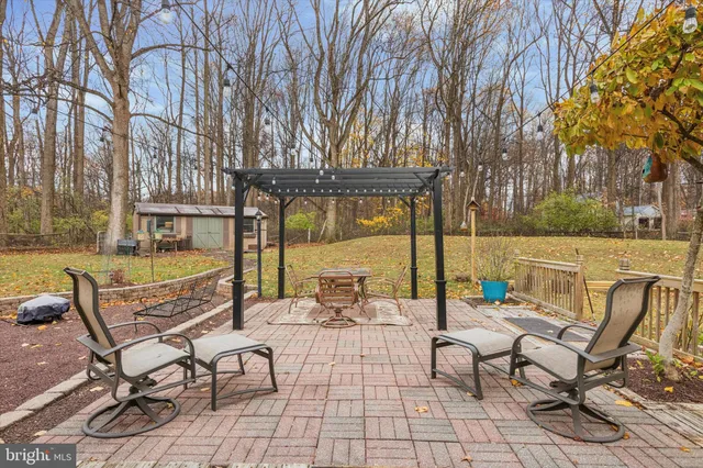 a view of a patio with swimming pool
