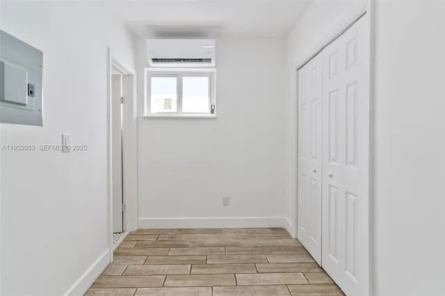 a view of an empty room with windows